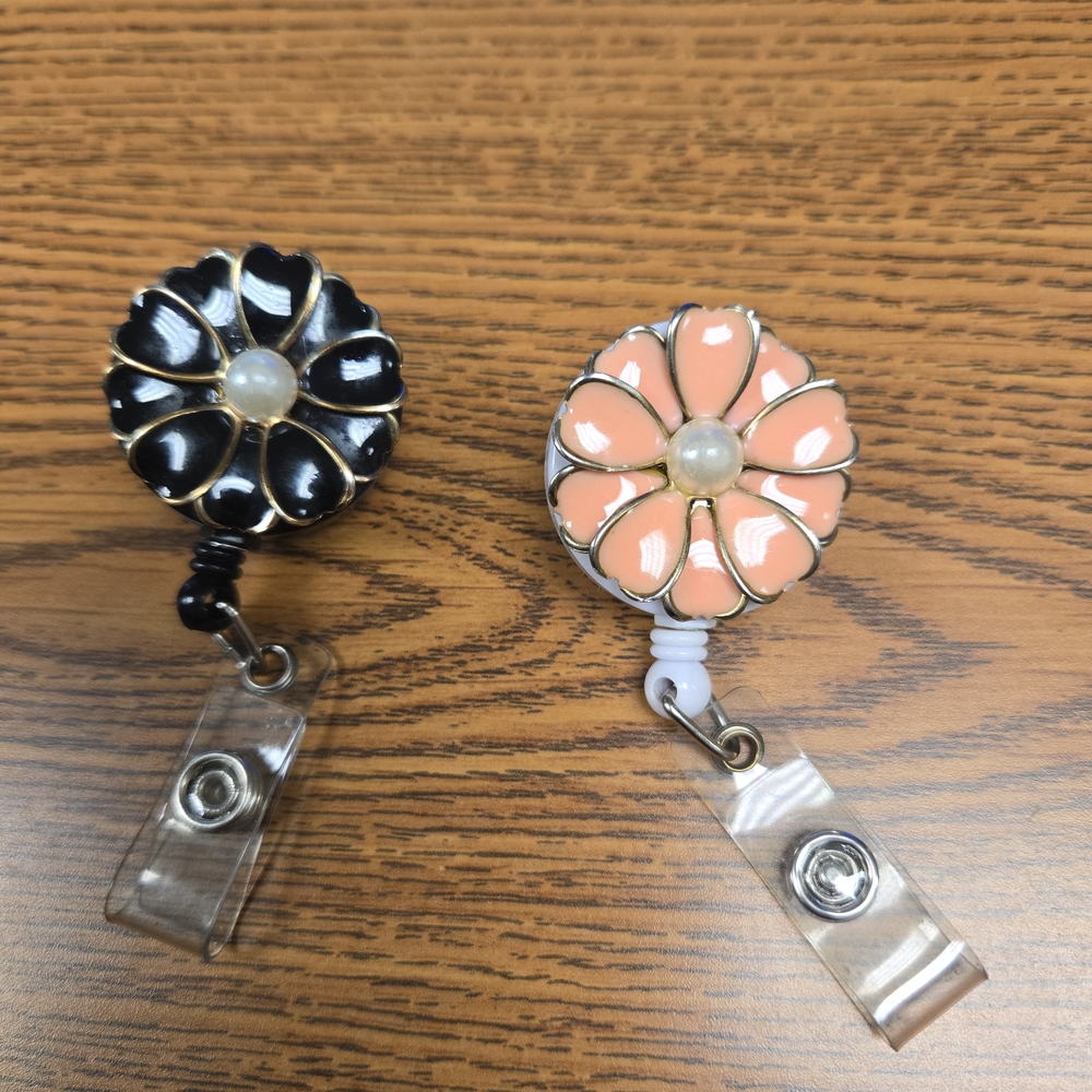 Floral Badge Reels in Black and Peach